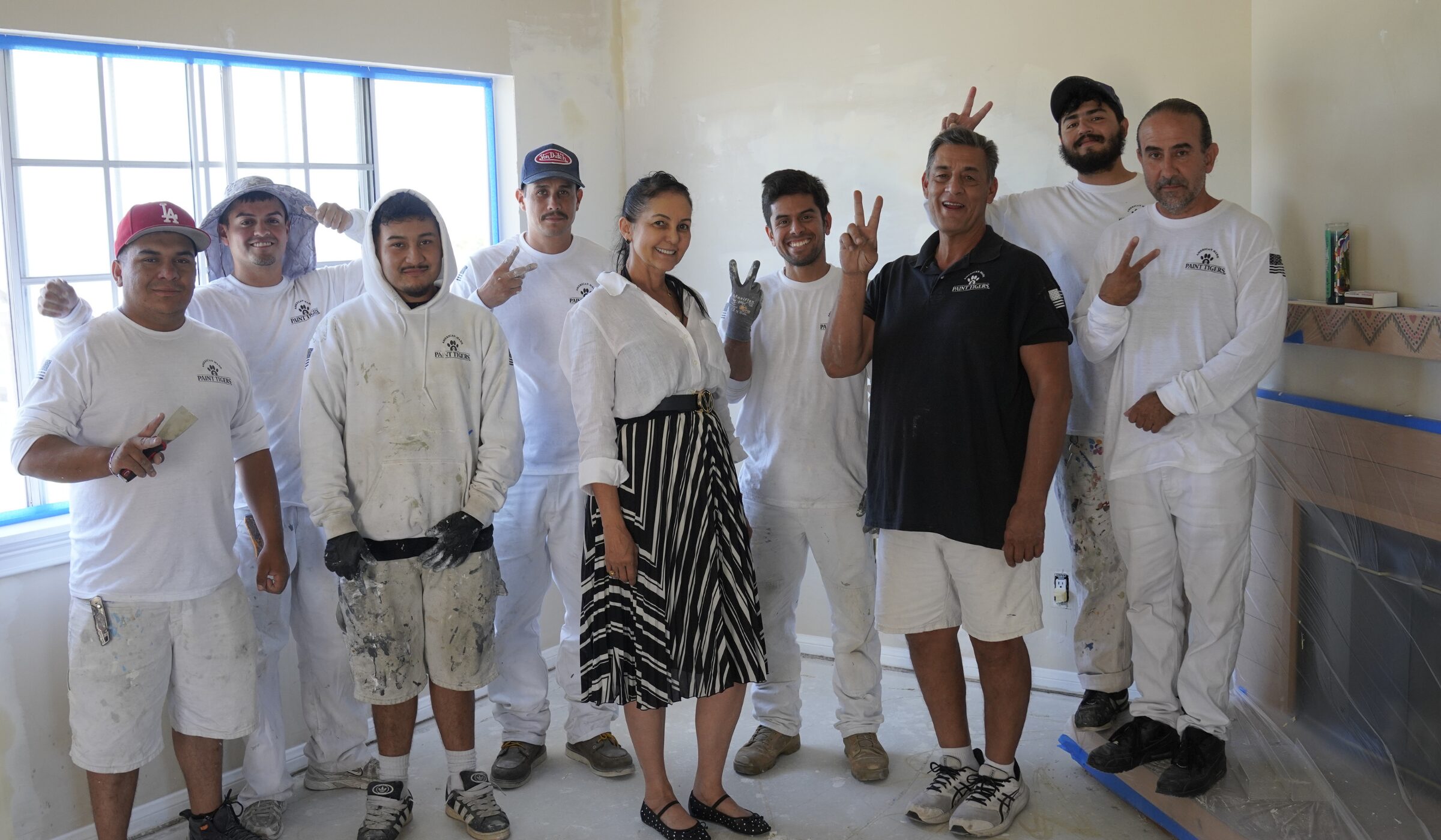 Paint Tigers owner and crew on a job in Plano